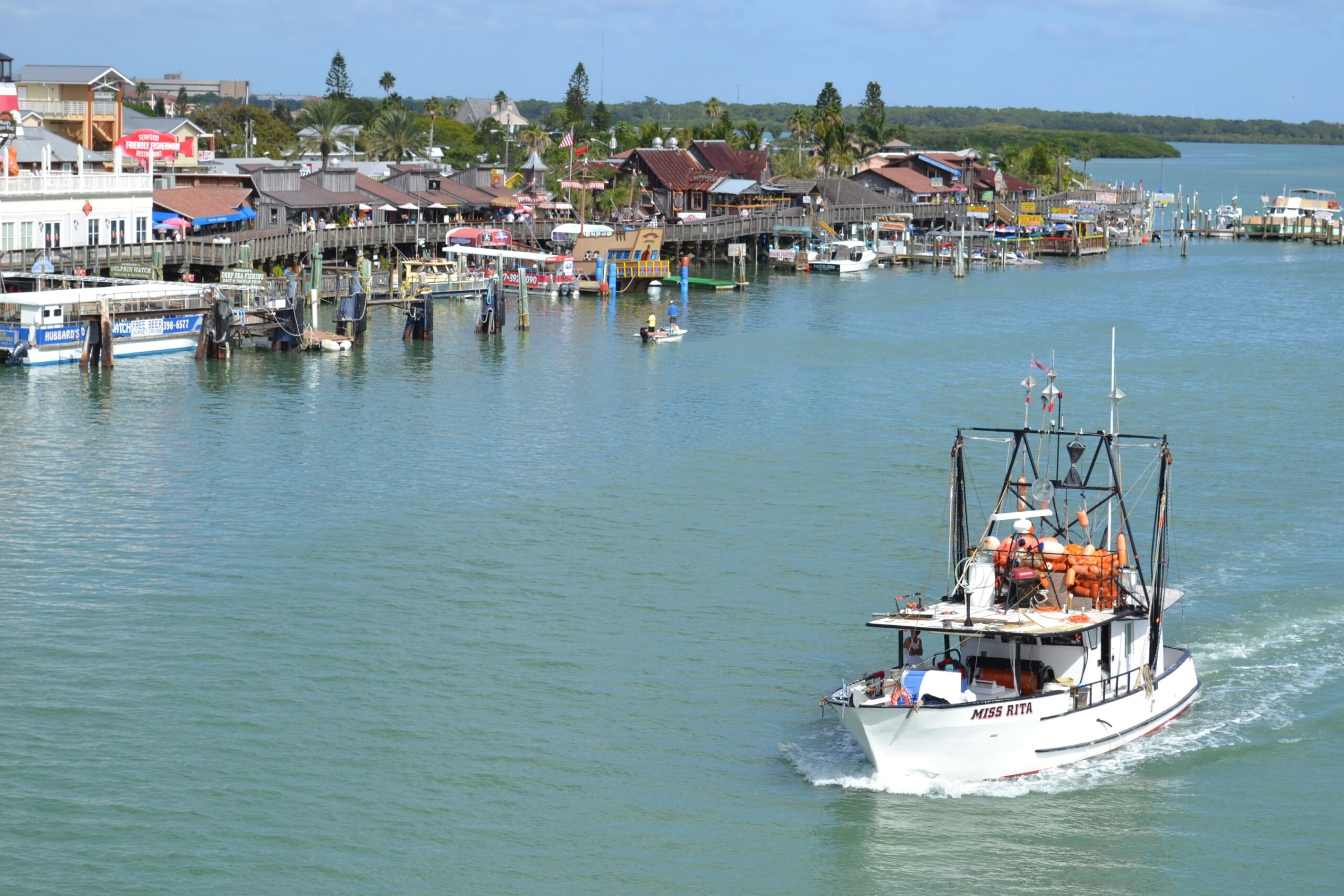 Image of Johns Pass from Johns Pass Bridge looking at Hubbards Marina and Miss Rita Boat